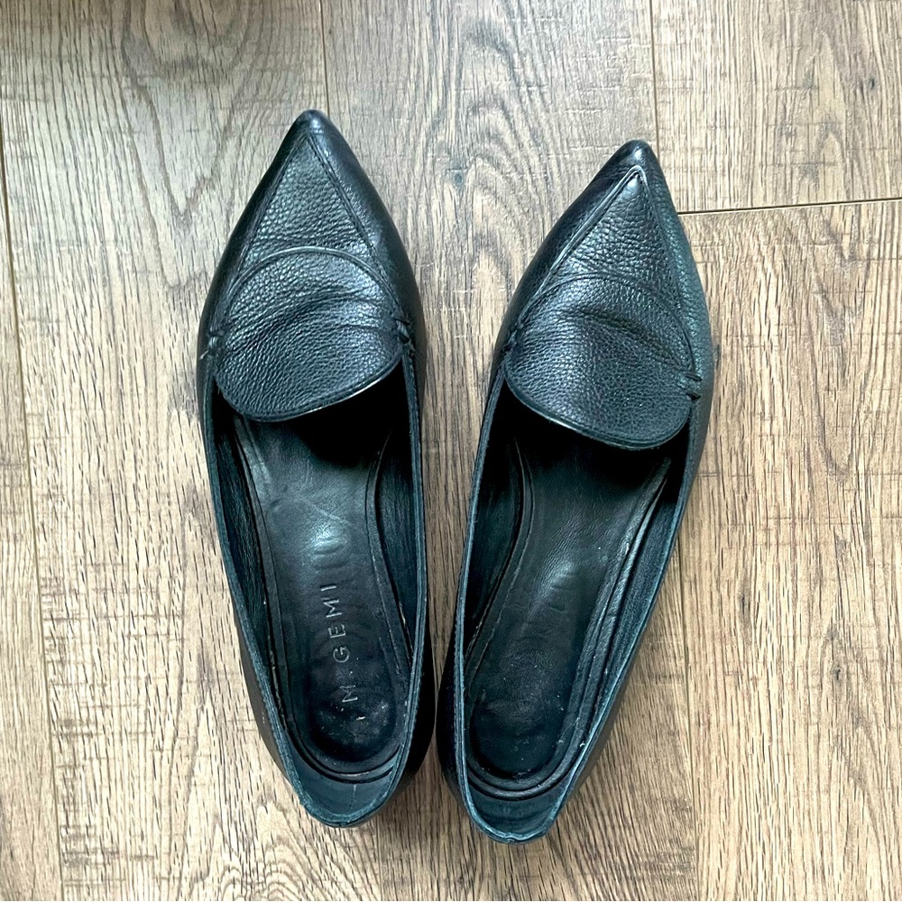 Pebbled black leather pointed toe loafers